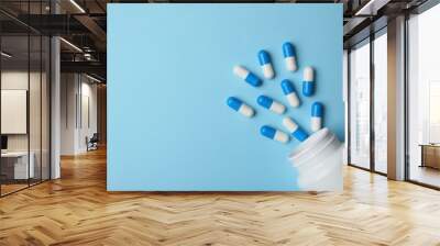 Bottle with pills on color background, flat lay. Space for text Wall mural