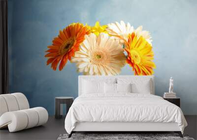 Bouquet of beautiful bright gerbera flowers on color background Wall mural