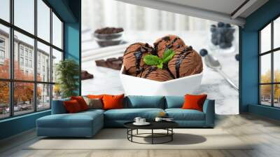 Bowl of chocolate ice cream and mint on marble table Wall mural