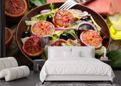 Bowl of delicious sicilian orange salad on wooden table, closeup Wall mural