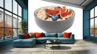 Bowl of oatmeal with blueberries, mint and fig pieces isolated on white Wall mural