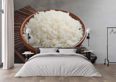 Bowl of tasty cooked white rice on grey table Wall mural