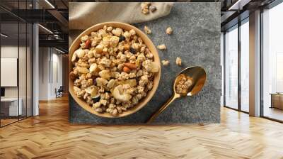 Bowl of tasty homemade granola on grey table, flat lay. Healthy breakfast Wall mural