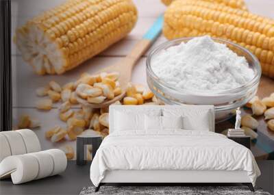 Bowl with corn starch, ripe cobs and kernels on wooden table Wall mural