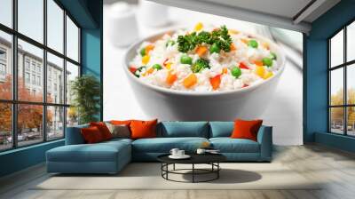 Bowl with tasty rice and vegetables on table, closeup Wall mural