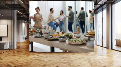 Brunch table setting with different delicious food.and blurred view of people on background Wall mural