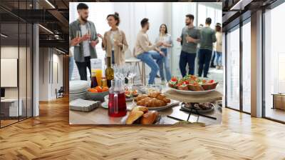 Brunch table setting with different delicious food.and blurred view of people on background Wall mural