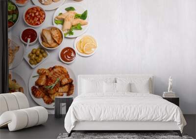 Buffet service. Flat lay composition with different dishes on white wooden table, space for text Wall mural