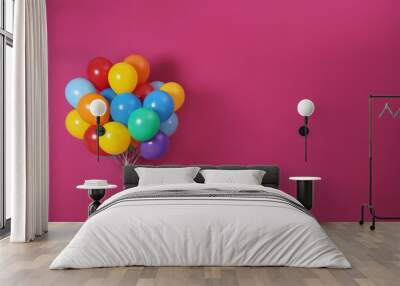 Bunch of bright balloons and space for text against color background Wall mural