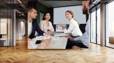 Business people having meeting in conference room with video projection screen Wall mural