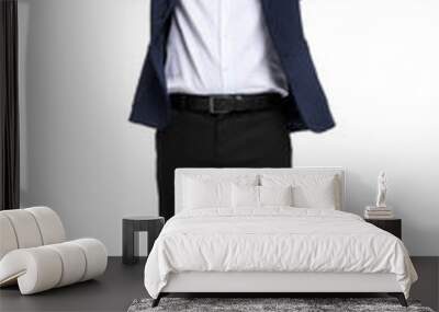 Businessman in suit posing on white background, low angle view Wall mural