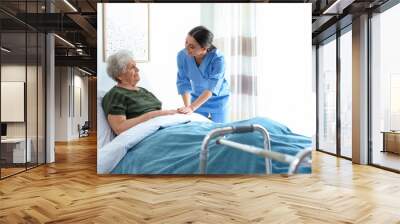 Care worker with elderly woman in geriatric hospice Wall mural