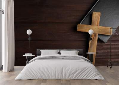 Christian cross and Bible on wooden background, top view with space for text. Religion concept Wall mural