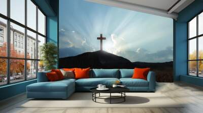 Christian cross on hill outdoors at sunrise. Resurrection of Jesus Wall mural