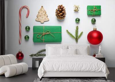 Christmas tree branches and festive decoration on white background, top view Wall mural