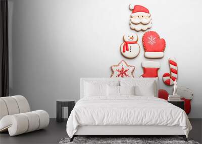 Christmas tree shape made of delicious gingerbread cookies on white background, flat lay. Space for text Wall mural