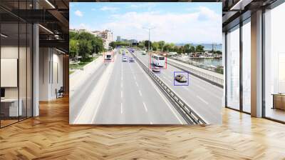 City road with scanner frames on cars near sea. Machine learning Wall mural