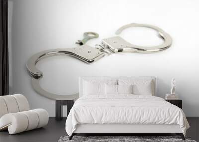 Classic chain handcuffs with key on white background Wall mural