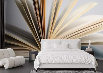 Closeup view of open book on light background Wall mural