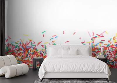 Colorful sprinkles on white background, top view. Confectionery decor Wall mural