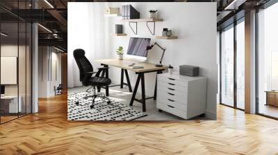 Comfortable office chair near table with modern computer Wall mural