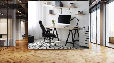 Comfortable office chair near table with modern computer Wall mural