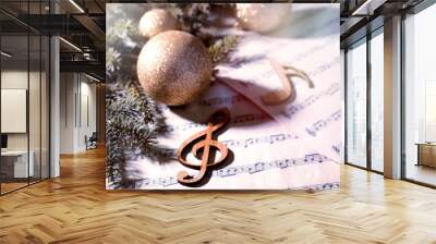 Composition with Christmas balls and wooden music notes on table Wall mural