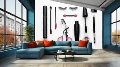 Composition with eyelash curler, makeup products and accessories on white background, top view Wall mural