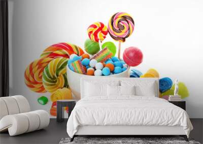 Composition with many different yummy candies on white background Wall mural