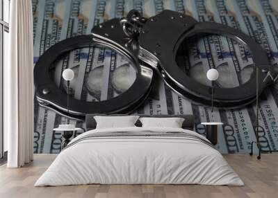 Corruption. Handcuffs on dollar banknotes, closeup view Wall mural