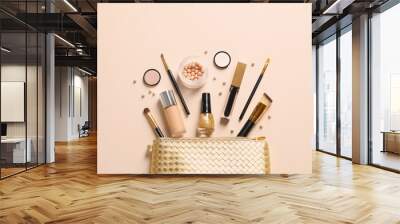 Cosmetic bag and different luxury makeup products on color background, flat lay Wall mural