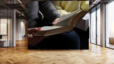 Couple sitting and reading holy Bibles, closeup Wall mural