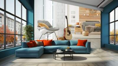 Cozy living room interior with comfortable furniture, guitar and autumn decor Wall mural