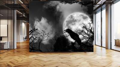 creepy black crow croaking in scary dark forest on full moon night Wall mural