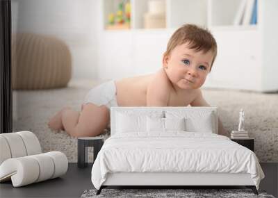 Cute baby boy crawling on carpet at home Wall mural