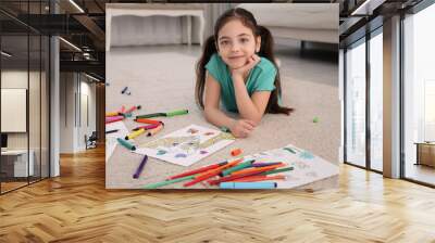 Cute child coloring drawing on floor at home Wall mural