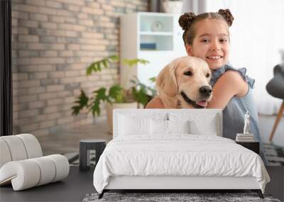 Cute little child with her pet on floor at home Wall mural