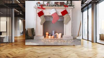 Decorative fireplace with beautiful decor and Christmas stockings indoors Wall mural