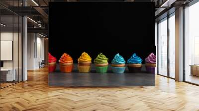 Delicious birthday cupcake on table against black background Wall mural