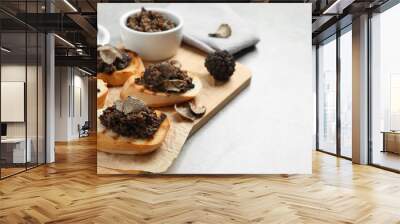 Delicious bruschettas with truffle sauce on light table. Space for text Wall mural