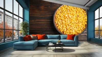 Delicious canned corn in bowl on wooden table, top view. Space for text Wall mural