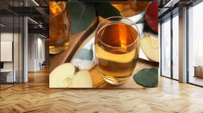 Delicious cider and ripe apples on wooden table Wall mural