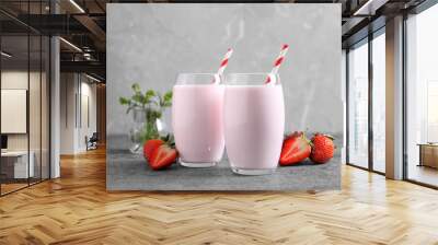 Delicious drink with strawberries on grey table Wall mural