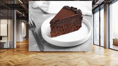 Delicious fresh chocolate cake served on grey table Wall mural