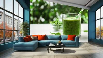 Delicious fresh green juice on white table, space for text Wall mural