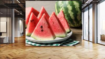 Delicious fresh watermelon slices on wooden table, closeup Wall mural