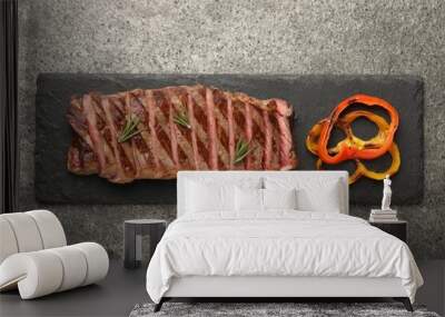 Delicious grilled beef steak with spices on gray table, top view Wall mural