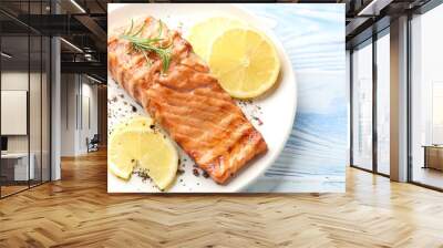 Delicious grilled salmon fillet served on light blue wooden table, closeup Wall mural