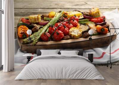 Delicious grilled vegetables with rosemary on wooden table Wall mural