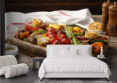 Delicious grilled vegetables with spices on wooden table, closeup Wall mural